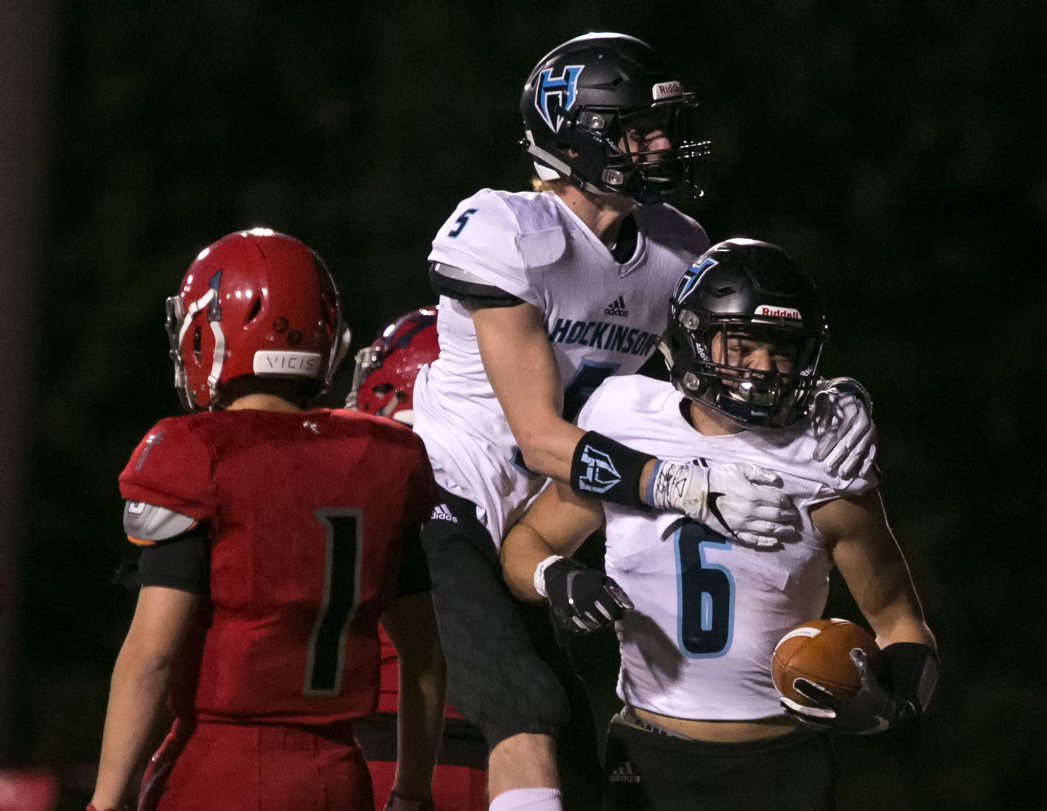 Hockinson’s Nick Charles (6) celebrates his touchdown with teammate Wyatt Jones (5) with Archbishop Murphys Matthew Mavis (left) walking away in the second quarter on Sept. 6, 2018, at Archbishop Murphy High School in Everett. (Kevin Clark / The Herald)