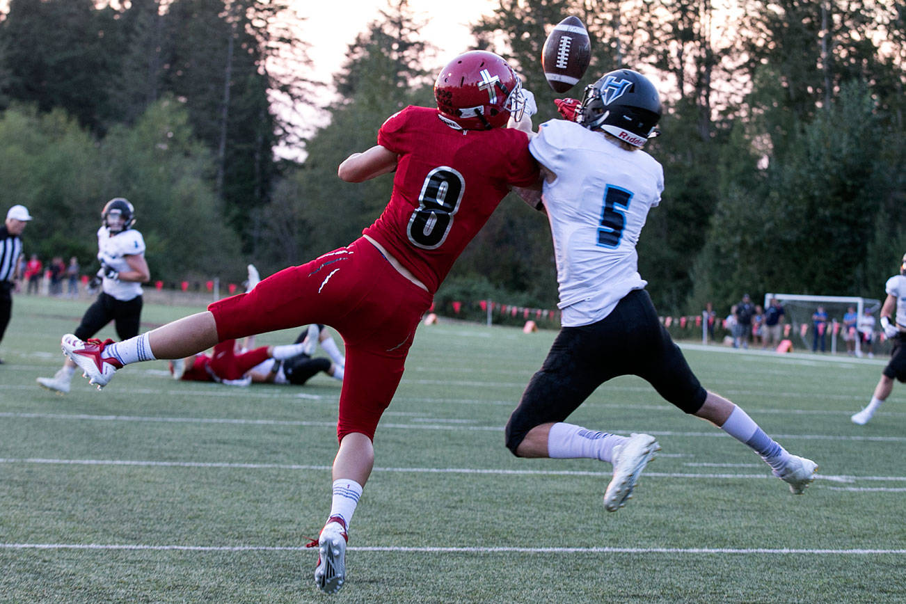 Hockinson’s Wyatt Jones (right) breaks up a pass intended for Archbishop Murphy’s Josh McCarron Thursday night at Archbishop Murphy High School in Everett on September 6, 2018. (Kevin Clark / The Herald)