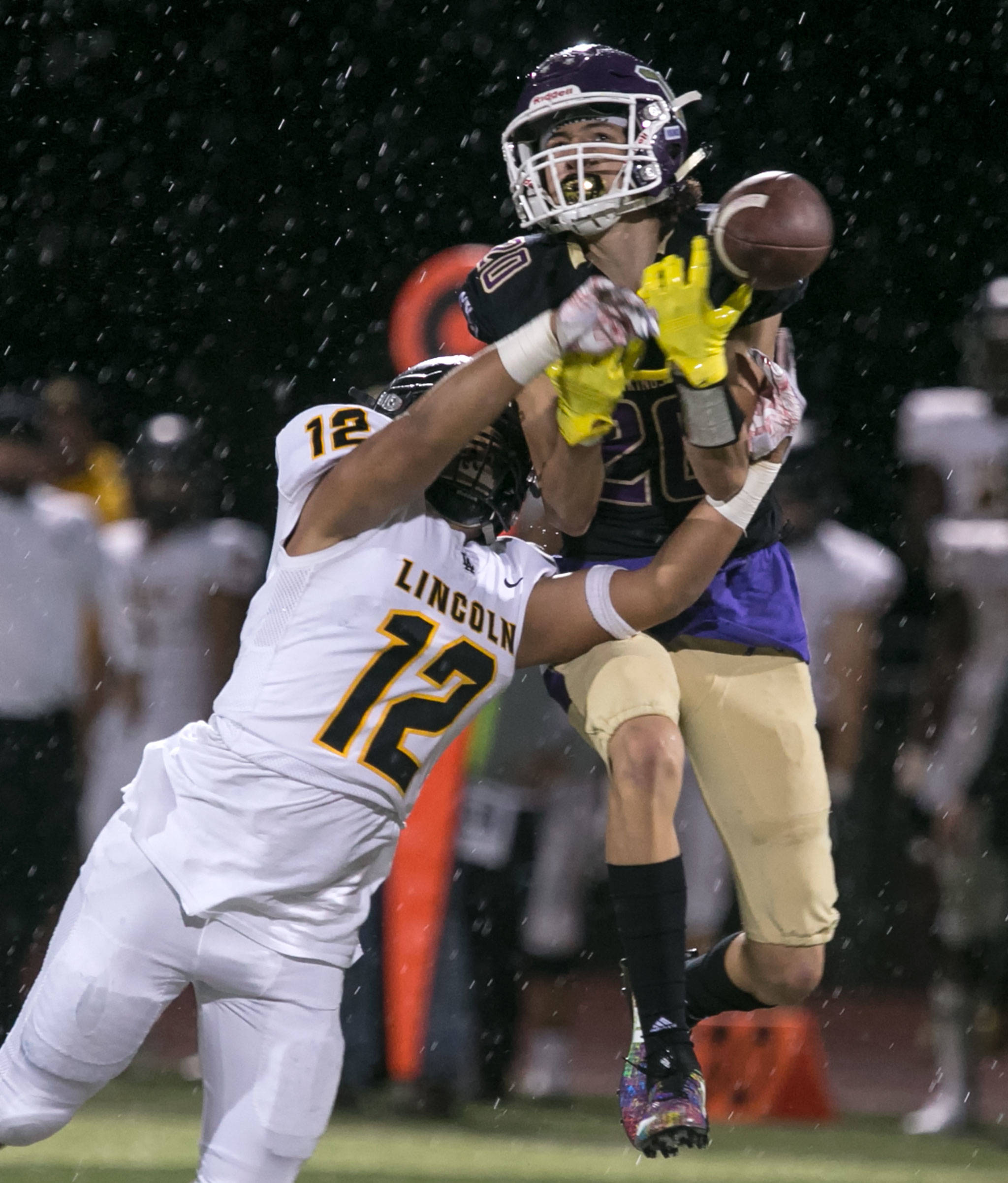 Lincoln’s Irae Savaiinaea breaks up a pass intended for Lake Stevens’ Joe Gonzales during a game on Sept. 7, 2018,at Lake Stevens High School. Lake Stevens won 38-21. (Kevin Clark / The Herald)