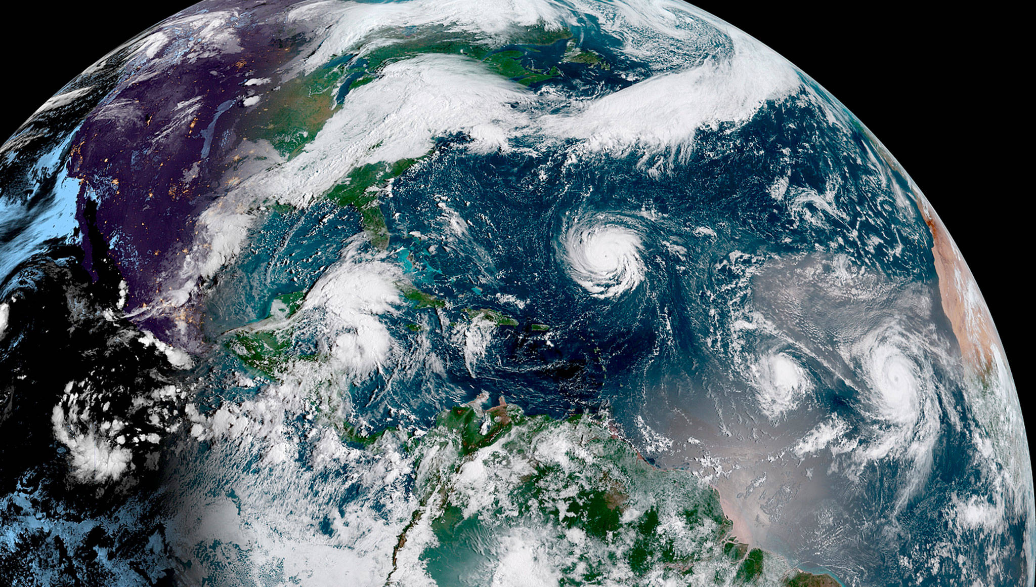 Hurricane Florence (center) approaches North America (left) at 9 a.m. EDT on Monday. (National Oceanic and Atmospheric Administration)