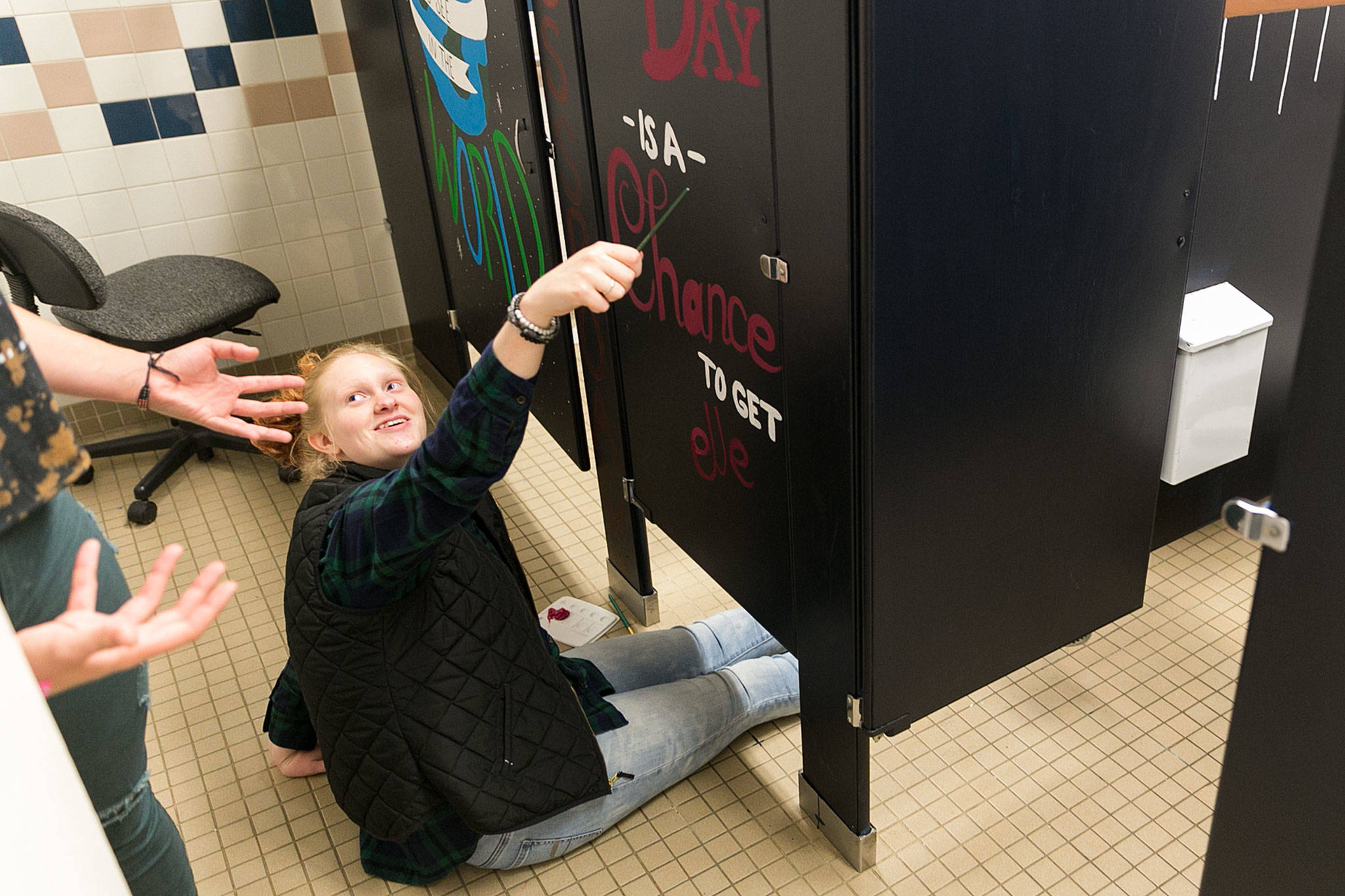 Madison Smith (right) directs Brianna Stockinger to the brushes Tuesday afternoon at Crossroads High School in Granite Falls on Sept. 11. (Kevin Clark / The Herald)