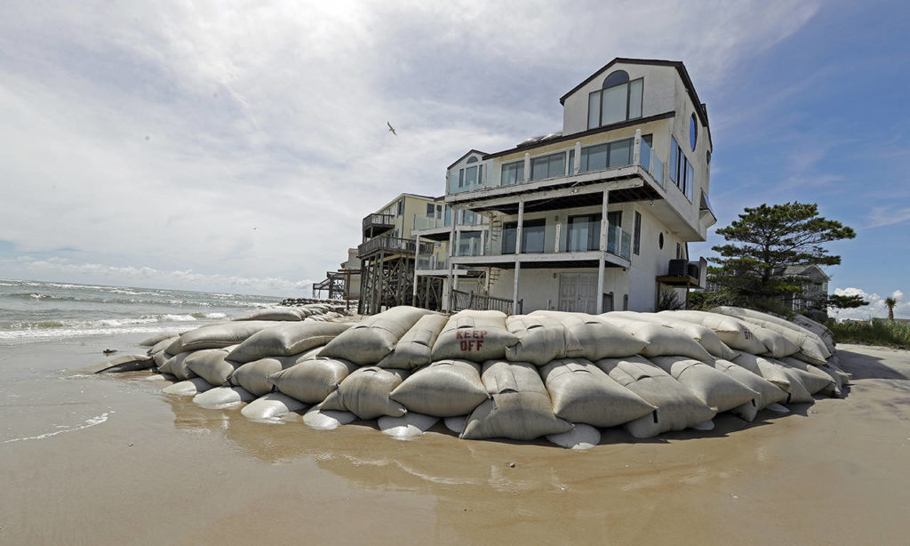 Sand bags surround homes on North Topsail Beach, North Carolina, on Wednesday as Hurricane Florence threatens the coast. (AP Photo/Chuck Burton)
