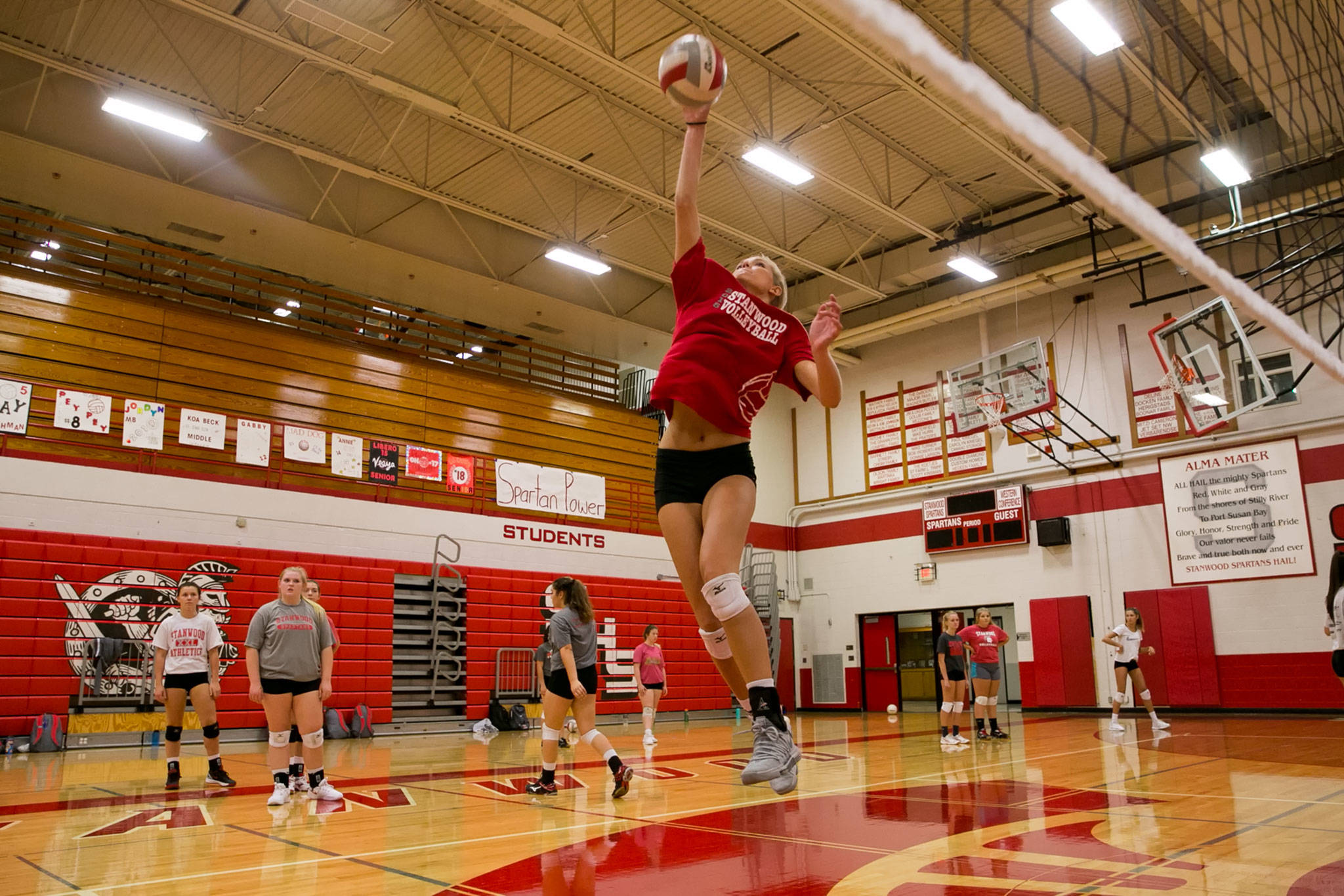 Stanwood senior Devon Martinka attempts a spike during practice on Sept. 12, 2018, at Stanwood High School. (Kevin Clark / The Herald)