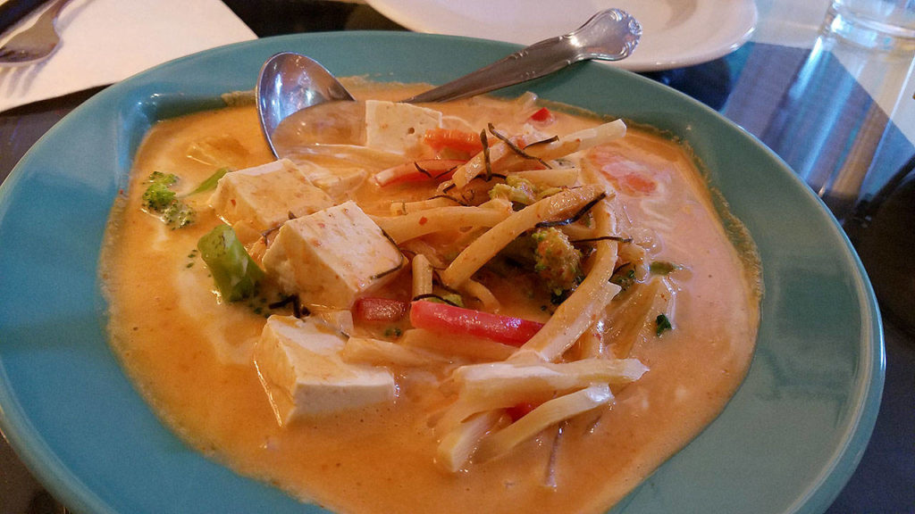 Red curry with soft tofu and a medley of red pepper, broccoli and carrots that were tender with a slight crunch. (Sharon Salyer / The Herald)
