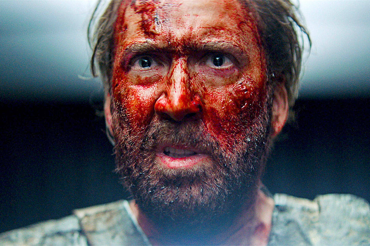 Nicolas Cage, clearly in need of a moist towelette or two, in a scene from “Mandy.” (Courtesy of Sundance Institute)