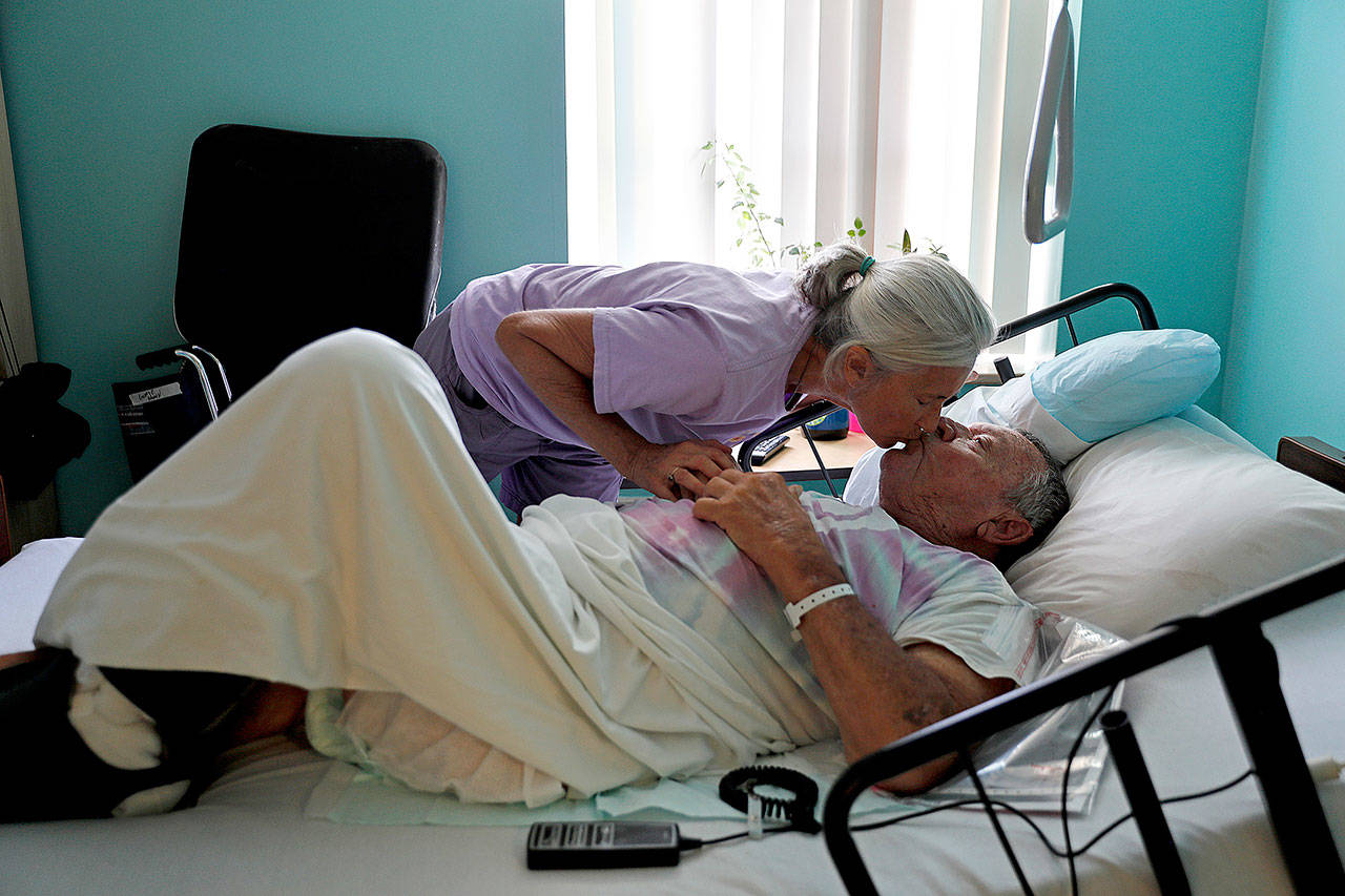 Marge Brown, 65, says goodbye to her father, George Brown, 90, before he is evacuated from a healthcare home in Morehead City, N.C., Wednesday as Hurricane Florence approaches the east coast. “I’d like to stay and see what happens. I’m 90 plus,” said Brown, a WWII veteran who says he’s survived a plane crash and severe burns from a laboratory fire where he once worked. (AP Photo/David Goldman)
