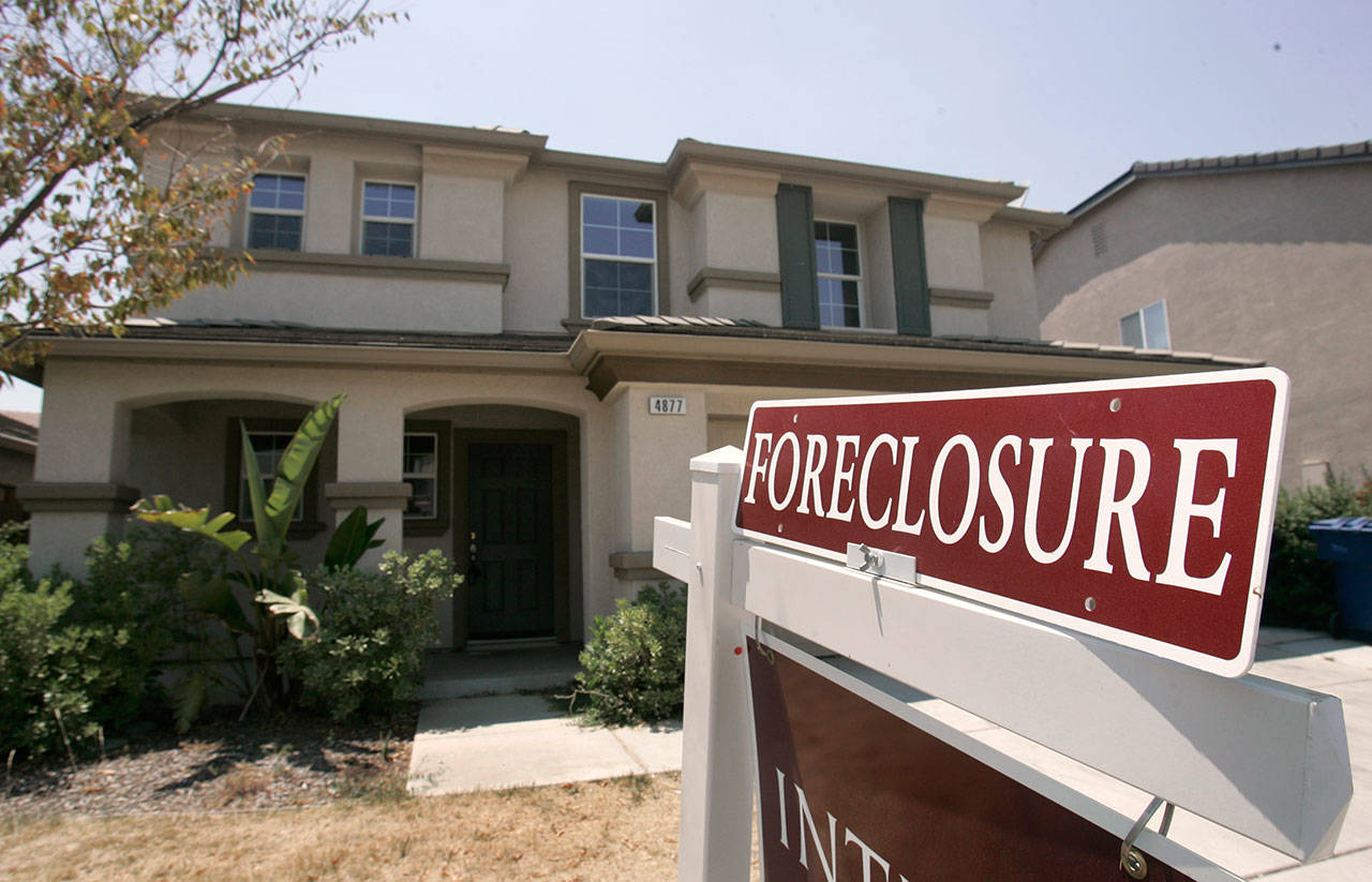 As home values plummeted after the housing bubble burst in 2007, many borrowers with exotic types of loans were stuck, unable to refinance as lenders began to tighten their lending criteria. That set the stage for cascading mortgage defaults. (AP Photo/Rich Pedroncelli, File)