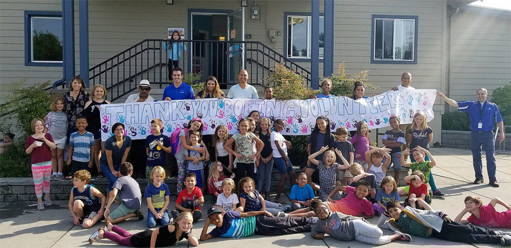 Volunteers from Boeing visited the Cascade Boys & Girls Club on Aug. 23 for a Liftoff For Learning celebration, where they distributed school supplies, served a healthy meal and played games. (Contributed photo)
