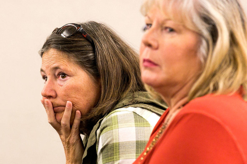Audience members listen to the presentation on gang activity Monday night at Explorer Middle School in Everett. (Kevin Clark / The Herald)
