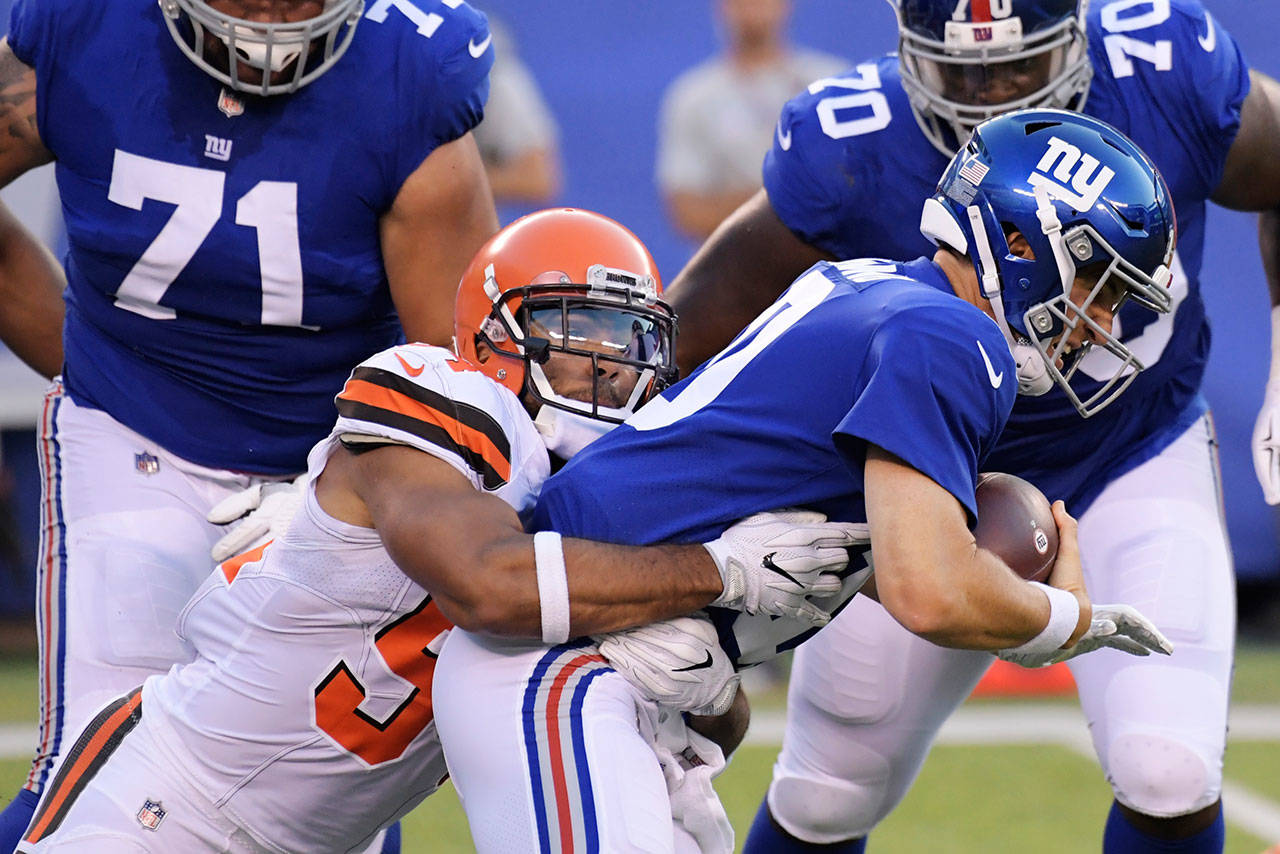 Linebacker Mychal Kendricks (54) sacks Giants quarterback Eli Manning (10) during the first half of a preseason game Aug. 9, 2018, in East Rutherford, N.J. The Seahawks signed Kendricks on Friday. (AP Photo/Bill Kostroun)