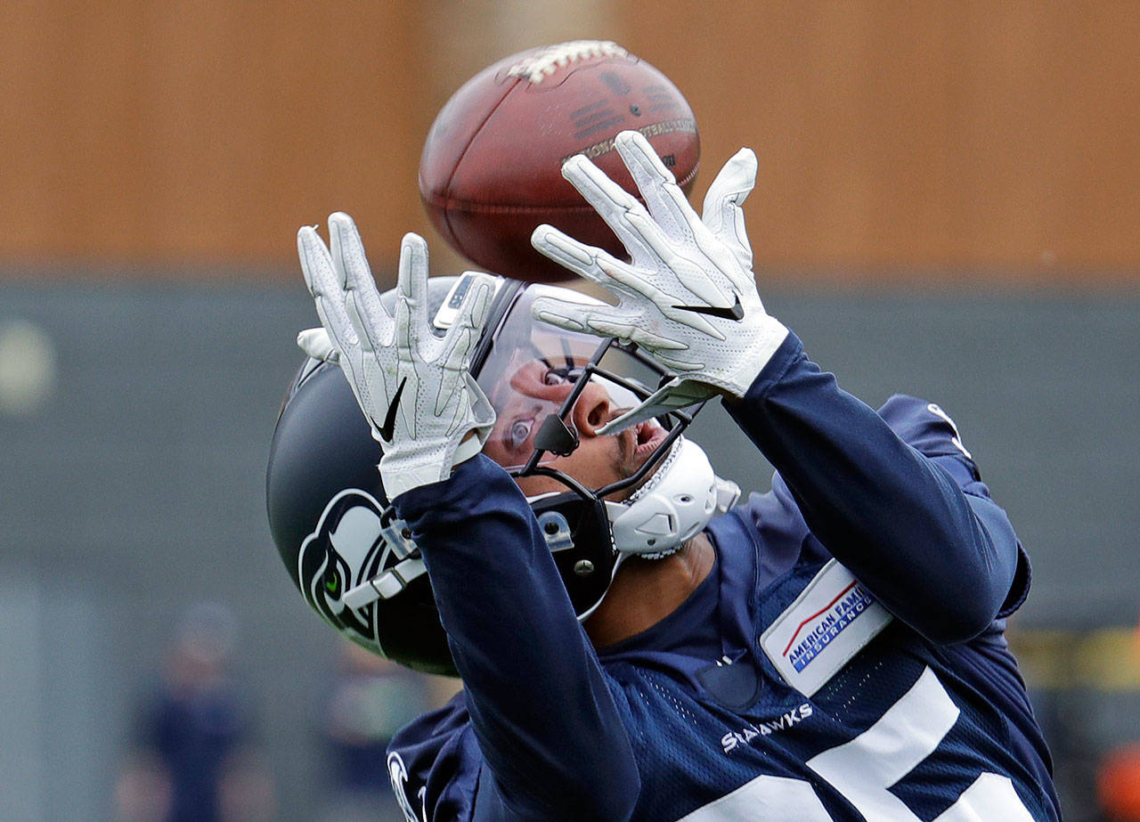 Seahawks wide receiver Keenan Reynolds reaches for the ball during a practice on June 12, 2018, in Renton. (AP Photo/Elaine Thompson)