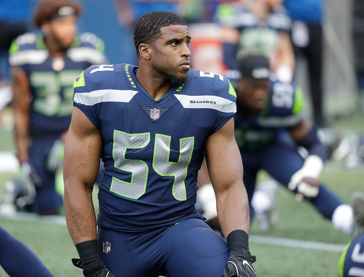 Seahawks linebacker Bobby Wagner stretches before a preseason game against the Colts on Aug. 9, 2018, in Seattle. (AP Photo/Elaine Thompson)