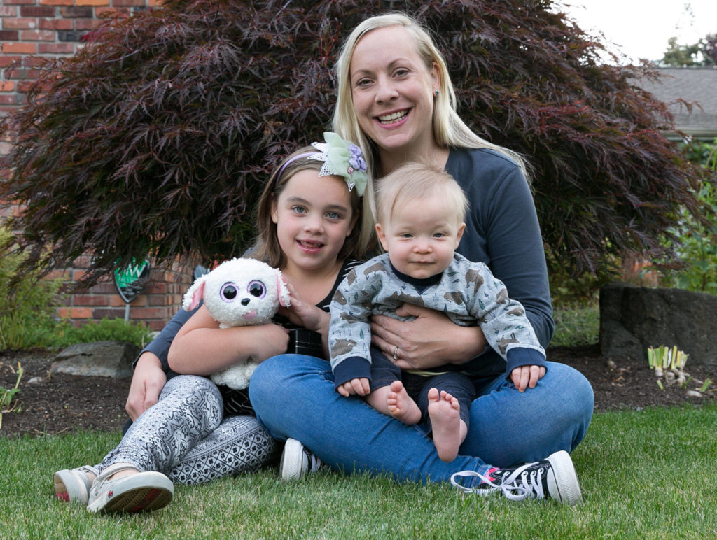 Rebecca Chadband’s landscape won an Evergreen Award for best maintained yard. She is pictured here with Beatrice, 5, and Westley, 9 months. (Kevin Clark / The Herald)
