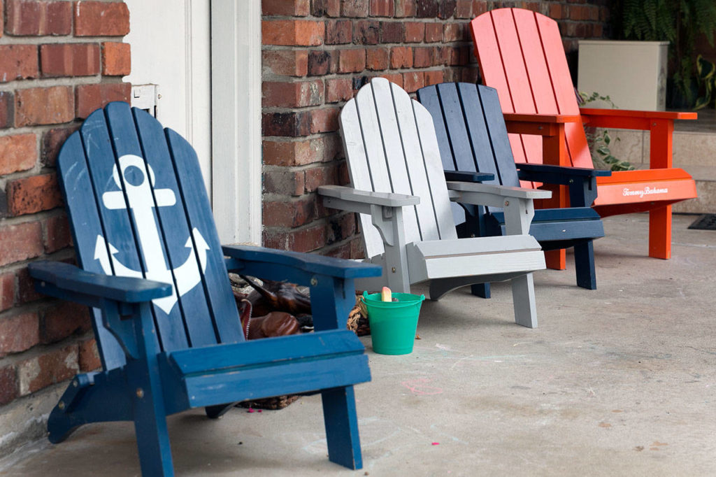 Adirondack chairs greet visitors to Rebecca Chadband’s home. (Kevin Clark / The Herald)
