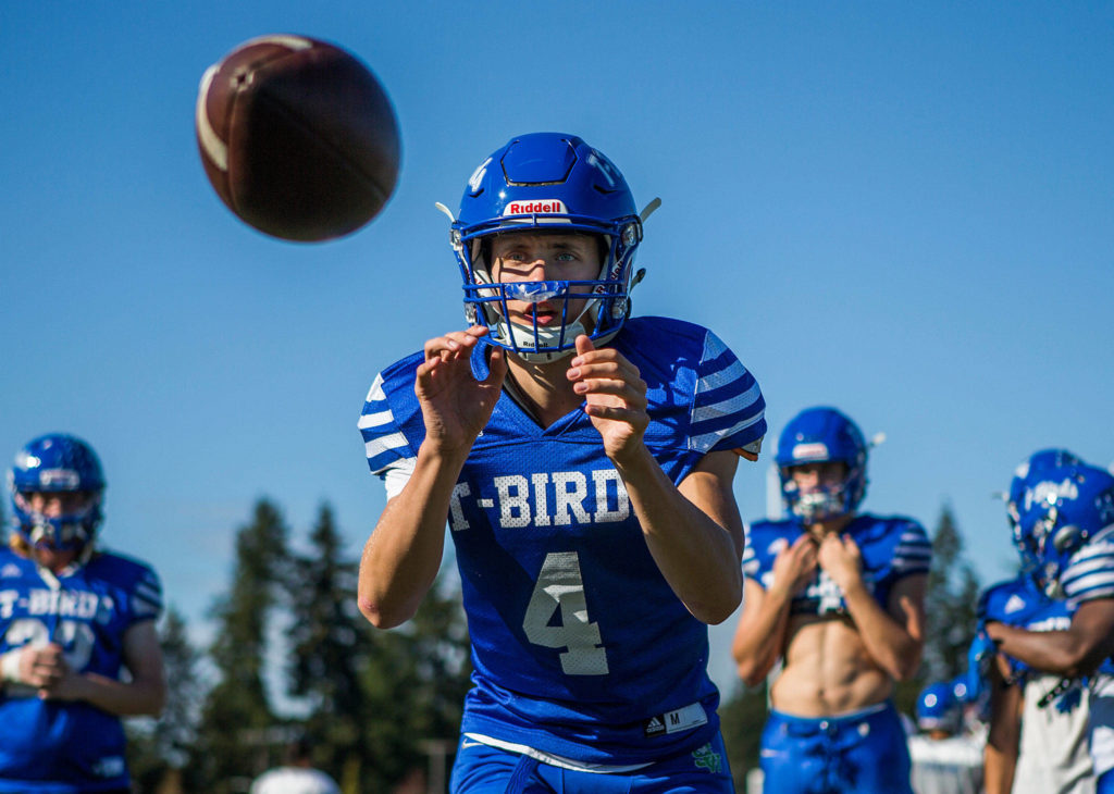 Shorewood quarterback David Snell catches a snap during practice Wednesday afternoon at Shorewood High School in Shoreline. (Olivia Vanni / The Herald)
