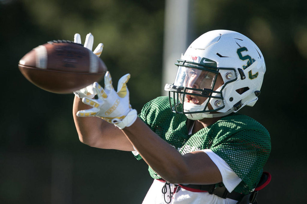 Shorecrest receiver Antonio Stillwell catches the ball during practice Wednesday afternoon at Shorecrest High School in Shoreline. Stillwell leads the Scots’ big-play passing attack with 382 yards receiving and five touchdown catches through three games. (Kevin Clark / The Herald)
