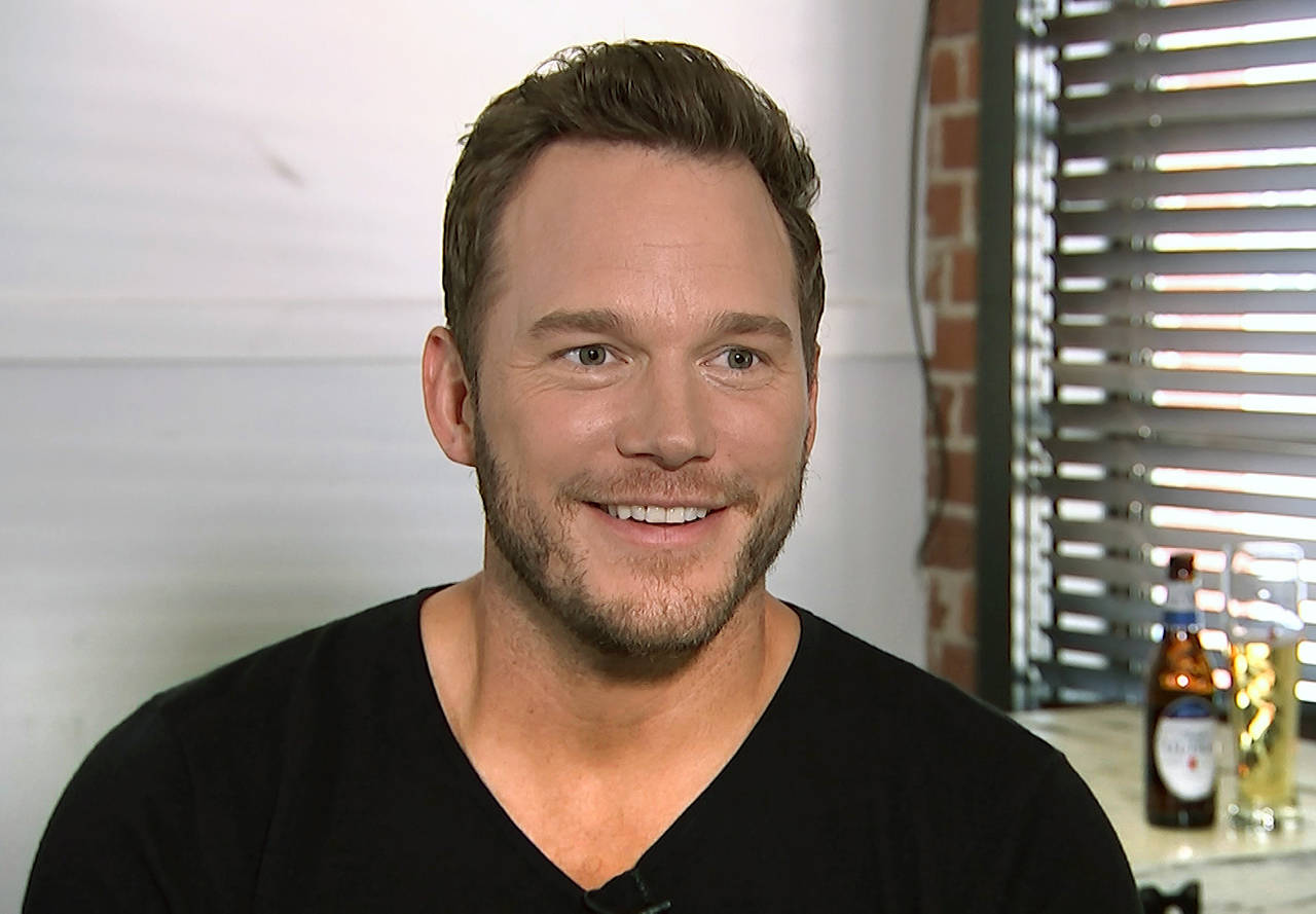 This Aug. 14 image taken from video shows actor Chris Pratt during an interview at the Fellow Bar in Los Angeles. Pratt met with disabled athletes as part of the nonprofit group Achilles International. He surprised them with the news that they’re being sponsored in the New York City Marathon. (AP Photo/Jeff Turner)