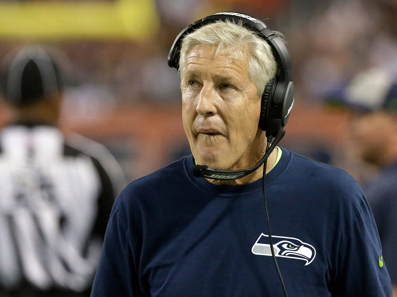 Seahawks head coach Pete Carroll looks at the scoreboard during the first half of a game against the Bears on Sept. 17, 2018, in Chicago. (AP Photo/David Banks)