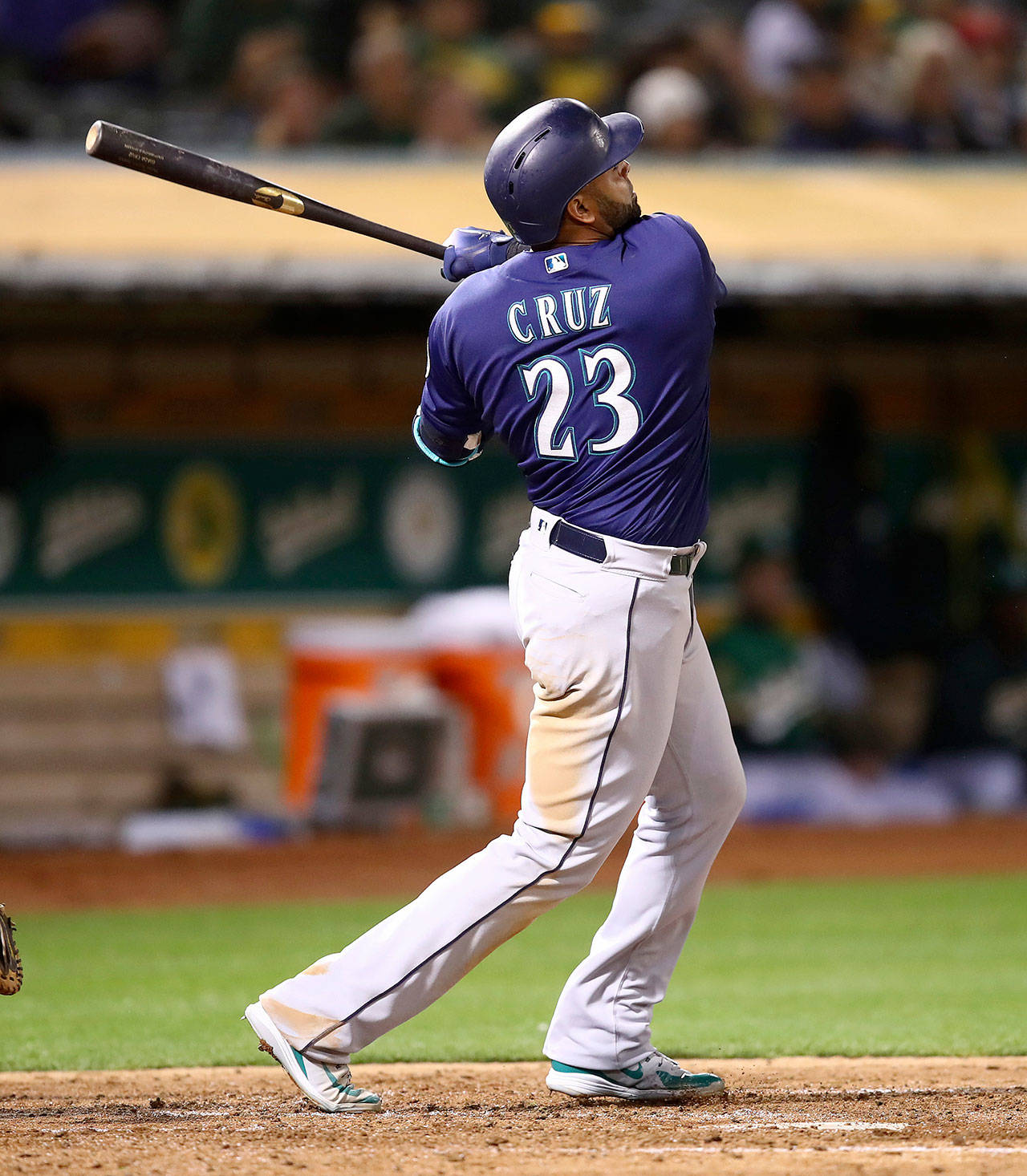 Seattle’s Nelson Cruz follows through on a home run against Oakland’s Mike Fiers during an Aug. 31 game in Oakland, California. (AP Photo/Ben Margot)