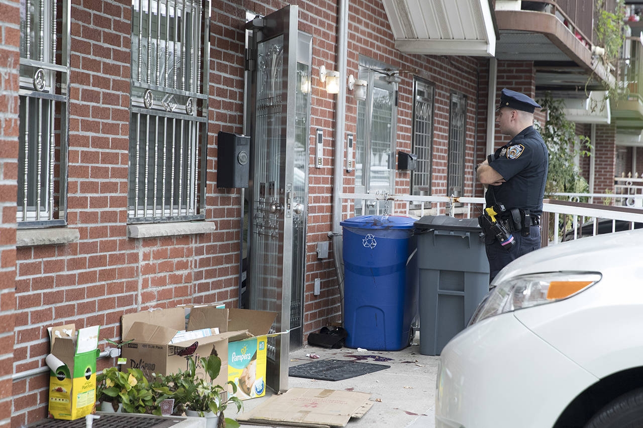 Police say five people, including three infants, were stabbed at an overnight day care center in New York City. (AP Photo/Mary Altaffer)