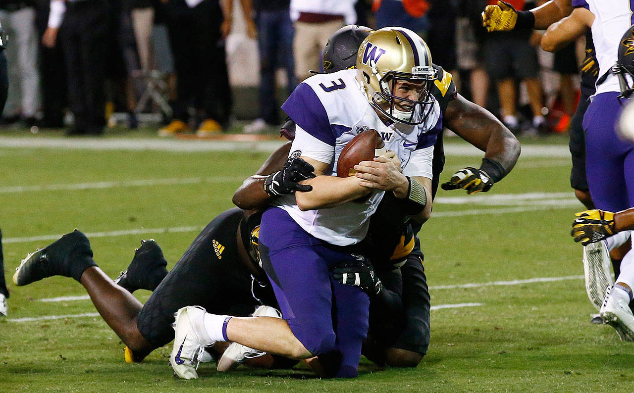 Washington quarterback Jake Browning (3) is tackled by the Arizona State defense short of the end zone during the second half of a game Oct. 14, 2017, in Tempe, Ariz. Arizona State defeated Washington 13-7. (AP Photo/Ross D. Franklin)