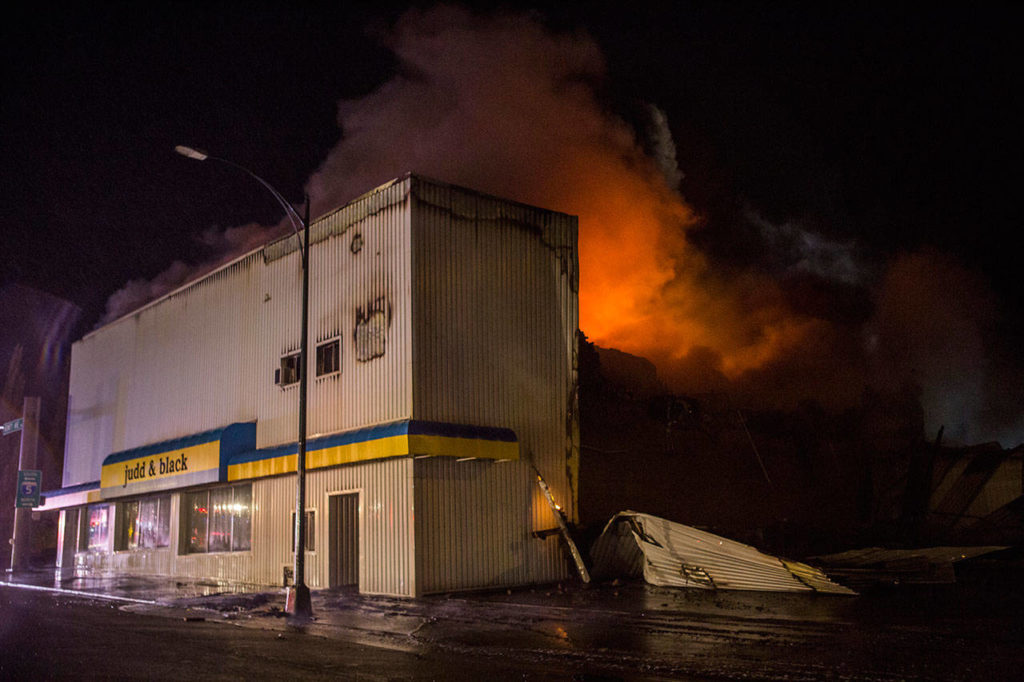 The Judd & Black appliance store at 3001 Hewitt Ave. in Everett burns late Friday. (Olivia Vanni / The Herald)
