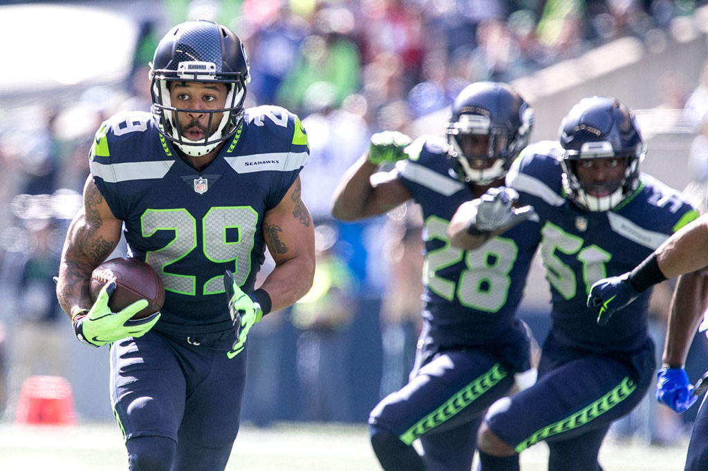 Seahawks Earl Thomas attempts a return after his first interception agains the Cowboys Sunday afternoon at CenturyLink Field in Seattle on September 23, 2018. Seahawks won 24-13. (Kevin Clark / The Herald)
