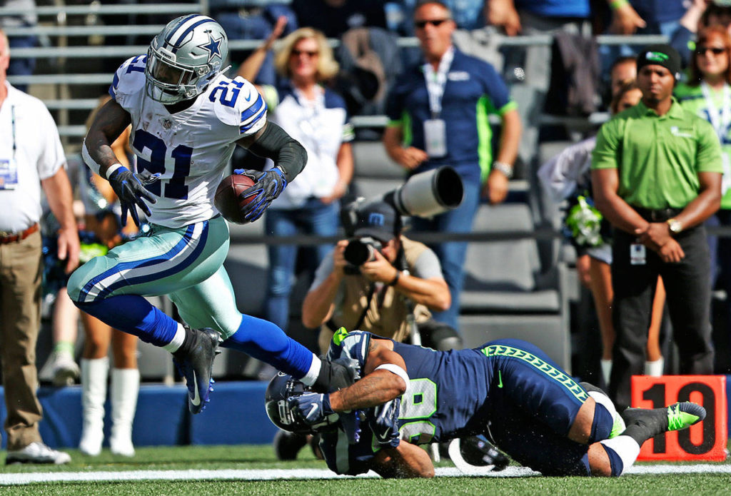 Seahawks’ Akeem King tries to tackle Cowboys’ Ezekiel Elliot during the game against the Dallas Cowboys on Sept. 23, 2018 in Seattle, Wa. (Olivia Vanni / The Herald)
