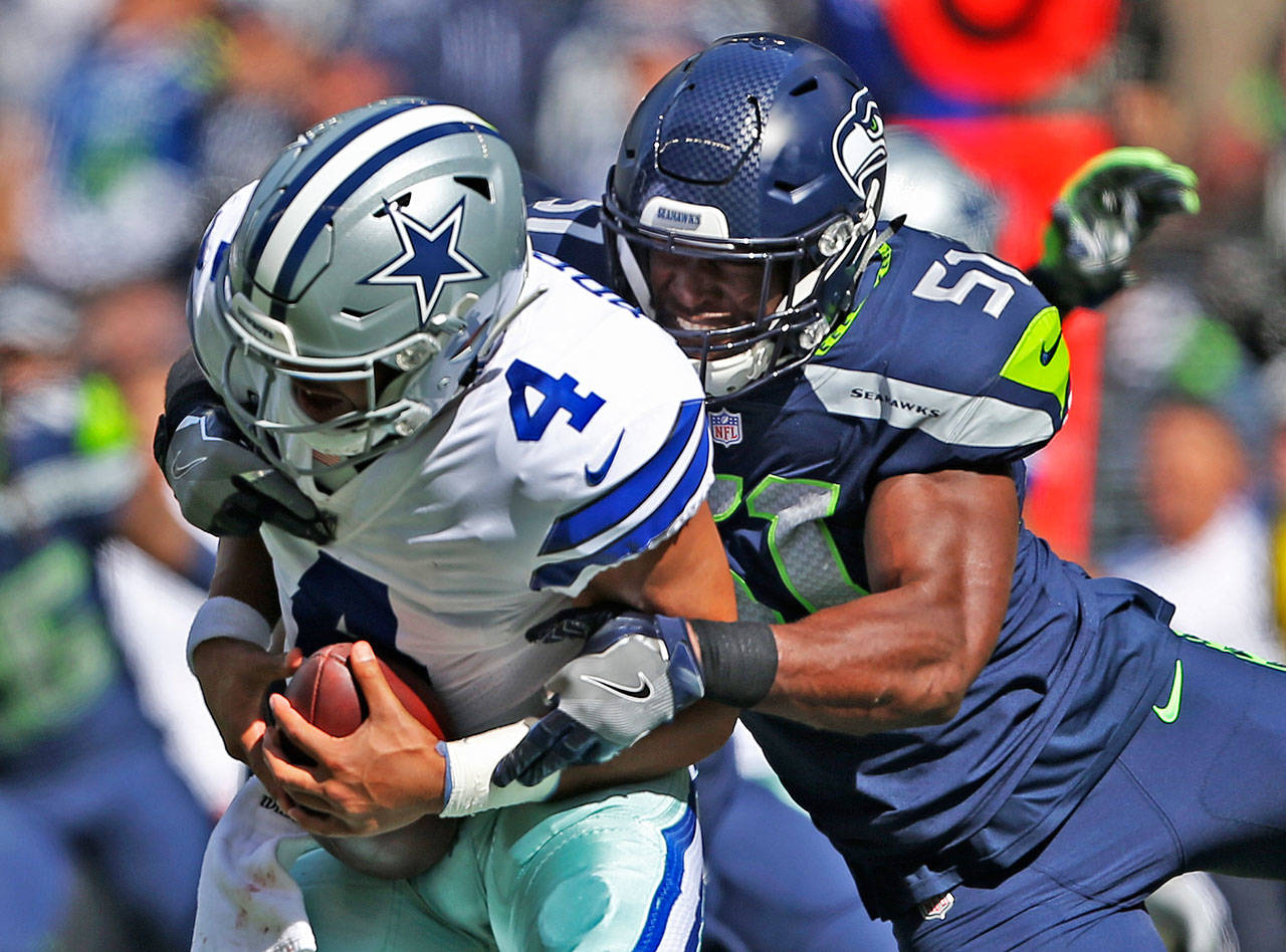 Seahawks’ Barkevious Mingo sacks Cowboys’ quarterback Dak Prescott during the game against the Dallas Cowboys on Sept. 23, 2018 in Seattle, Wa. (Olivia Vanni / The Herald)