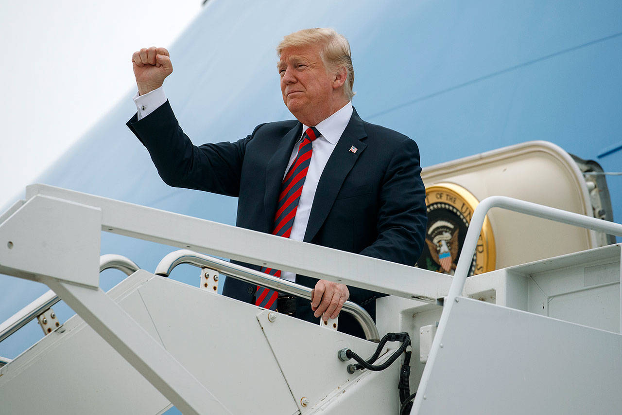 President Donald Trump gestures as he arrives Friday at Springfield-Branson National Airport in Missouri before attending a campaign rally. (AP Photo/Evan Vucci, File)