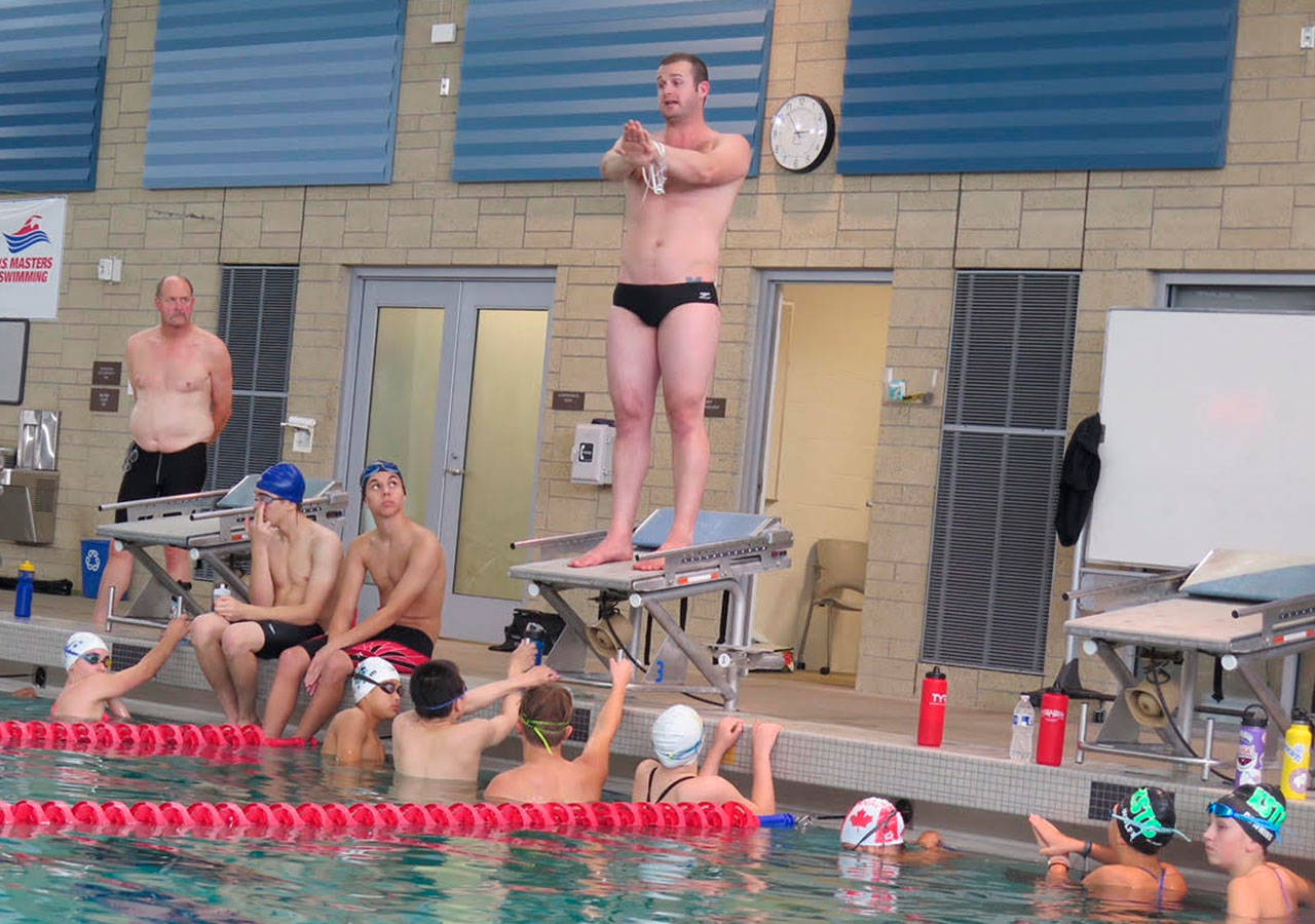 Olympic gold medalist Tyler Clary instructs a group of young swimmers at the Snohomish Aquatic Center over the weekend.