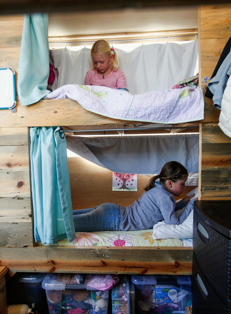 Each of the Taisey kids have their own custom beds with privacy curtains and wall-to-wall mattresses. (Dan Bates / The Herald)
