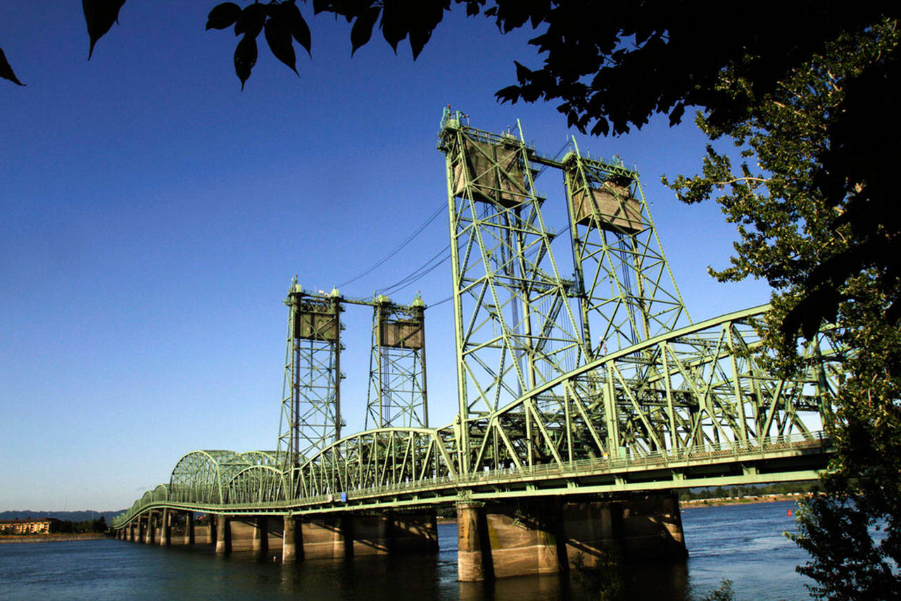 The I-5 bridges span the Columbia River between Oregon and Washington states. Oregon House Speaker Tina Kotek wants to sit down with Washington lawmakers before the end of the year to resume discussions about replacing the two bridges, shown here in 2011. (Don Ryan / Associated Press file photo)
