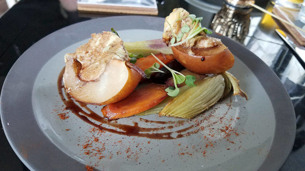 Stuffed baked pears with cashew blue cheese, grilled fennel bulb and rainbow carrots at Sage & Cinder, a vegan restaurant in Mukilteo. (Sharon Salyer / The Herald)
