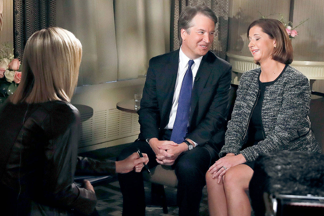 Brett Kavanaugh and his wife, Ashley Estes Kavanaugh, at the start of a Fox News interview with Martha MacCallum on Monday in Washington. (AP Photo/Jacquelyn Martin)
