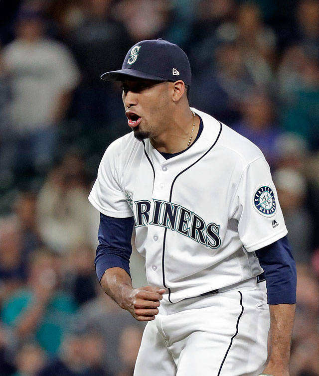 Mariners closer Edwin Diaz reacts after striking out an Orioles in the ninth inning of a game Sept. 3, 2018, in Seattle. The Mariners won 2-1. (AP Photo/Elaine Thompson)