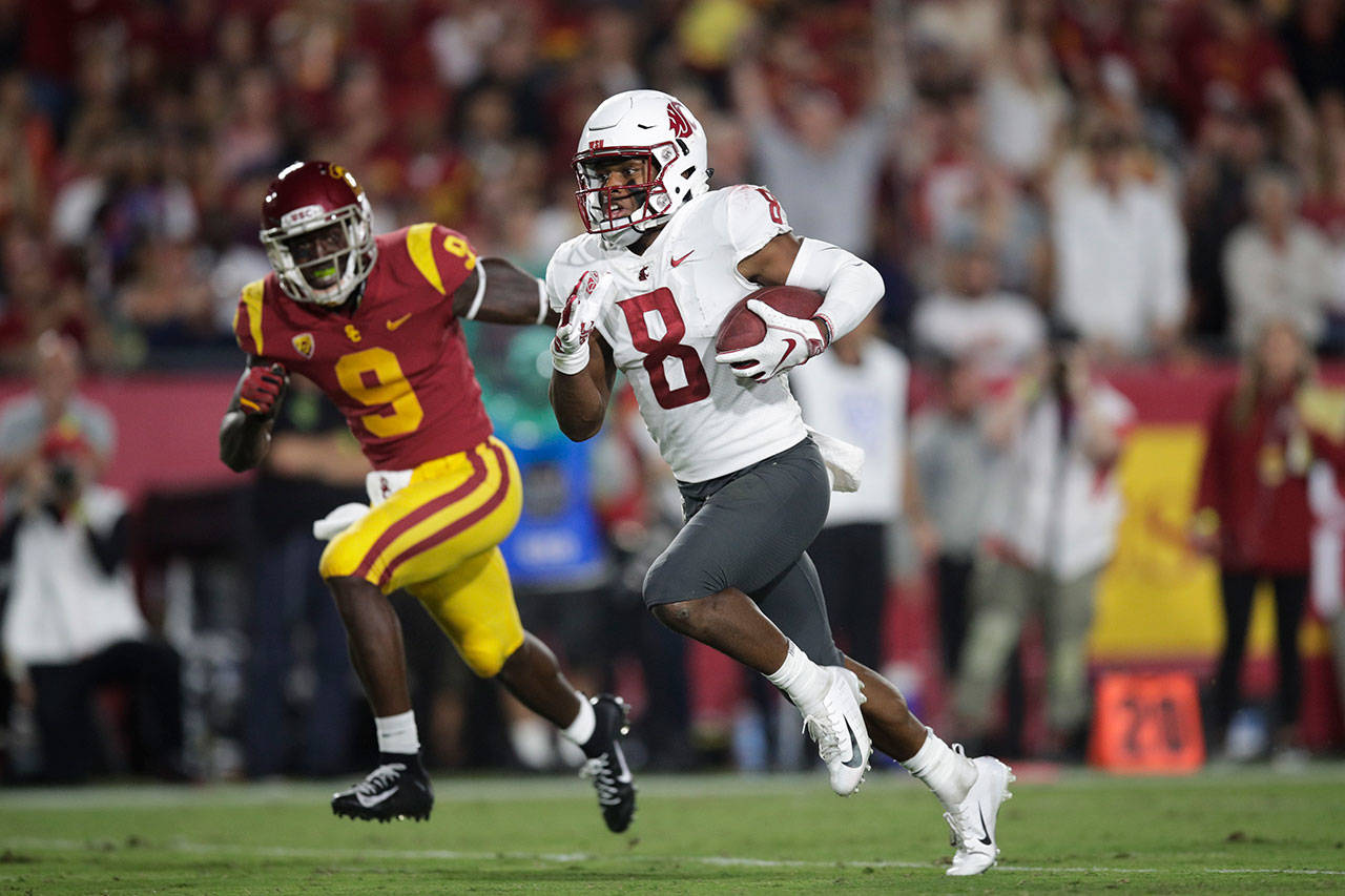 Washington State wide receiver Easop Winston (8) runs toward the end zone past Southern California cornerback Greg Johnson for a touchdown during the first half of a game on Sept. 21, 2018, in Los Angeles. (AP Photo/Jae C. Hong)