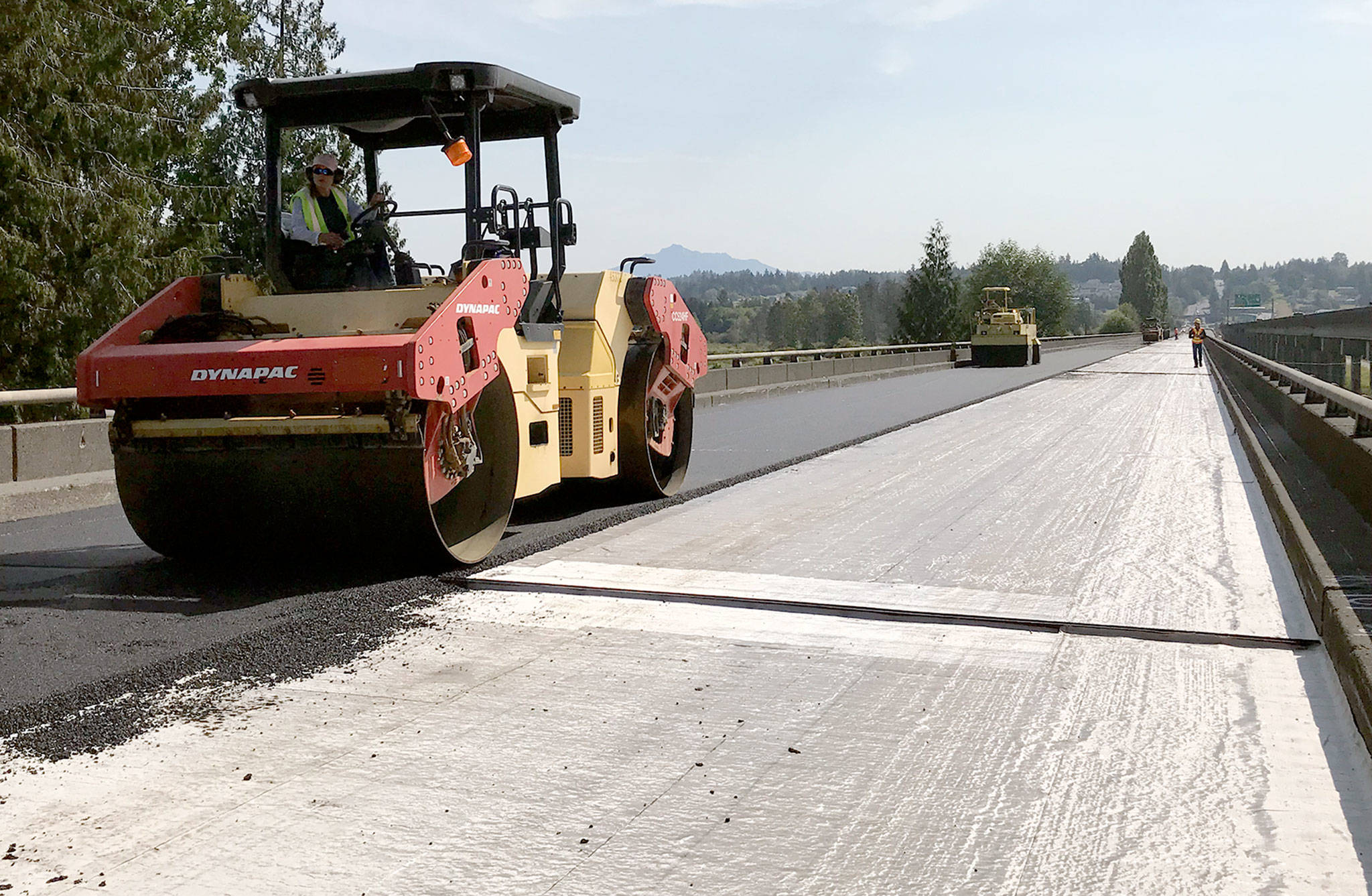 Paving work on the U.S. 2 trestle on Aug. 5 — a weekend when the weather actually cooperated with moisture-sensitive construction. (Washington State Department of Transportation) 20180805