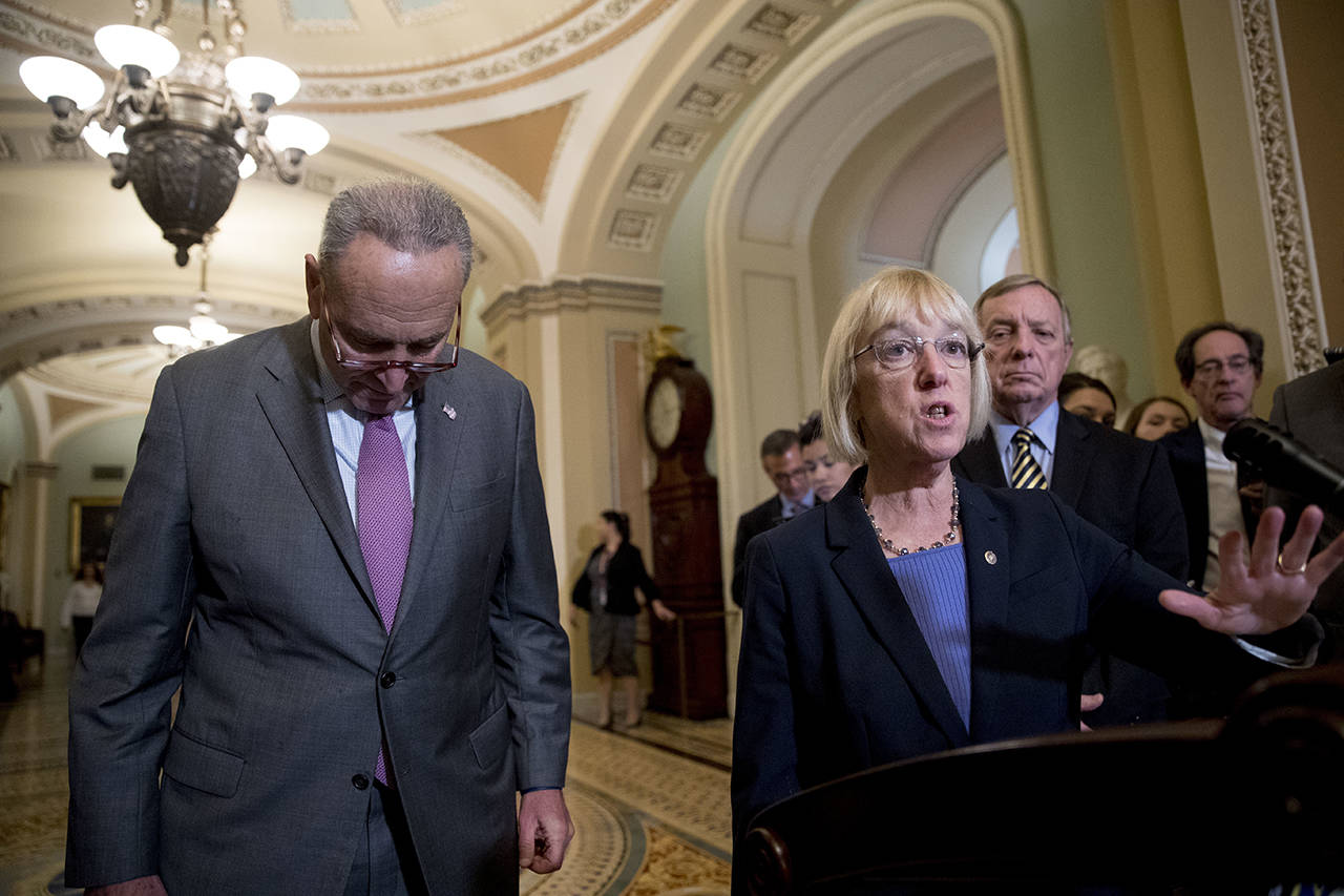 Sen. Patty Murray, D-Wash. (second from left), accompanied by Senate Minority Leader Sen. Chuck Schumer of New York (left), and Sen. Dick Durbin, D-Ill. (right), speaks to reporters following a closed-door Democratic policy meeting, at the Capitol in Washington on Tuesday. (AP Photo/Andrew Harnik, file)
