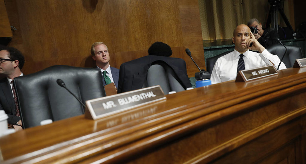 Sen. Cory Booker, D-N.J., looks past empty seats after Democratic members of the Senate Judiciary Committee walked out of the meeting, Friday on Capitol Hill in Washington. (AP Photo/Pablo Martinez Monsivais)
