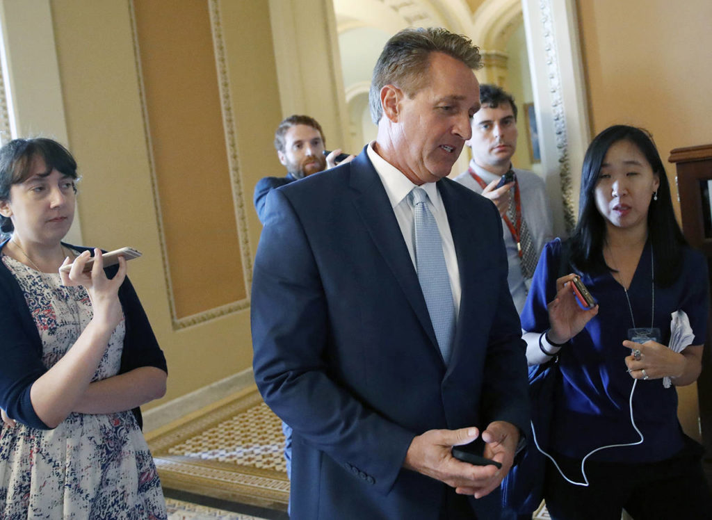 Arizona Sen. Jeff Flake, a member of the panel, seen here Wednesday on Capitol Hill, announced he would vote to confirm Kavanaugh, who he said was entitled to the “presumption of innocence … absent corroborating evidence.” (AP Photo/Alex Brandon, file)
