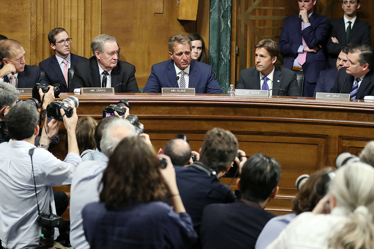 Trump bows to pressure, agrees to FBI probe of Kavanaugh