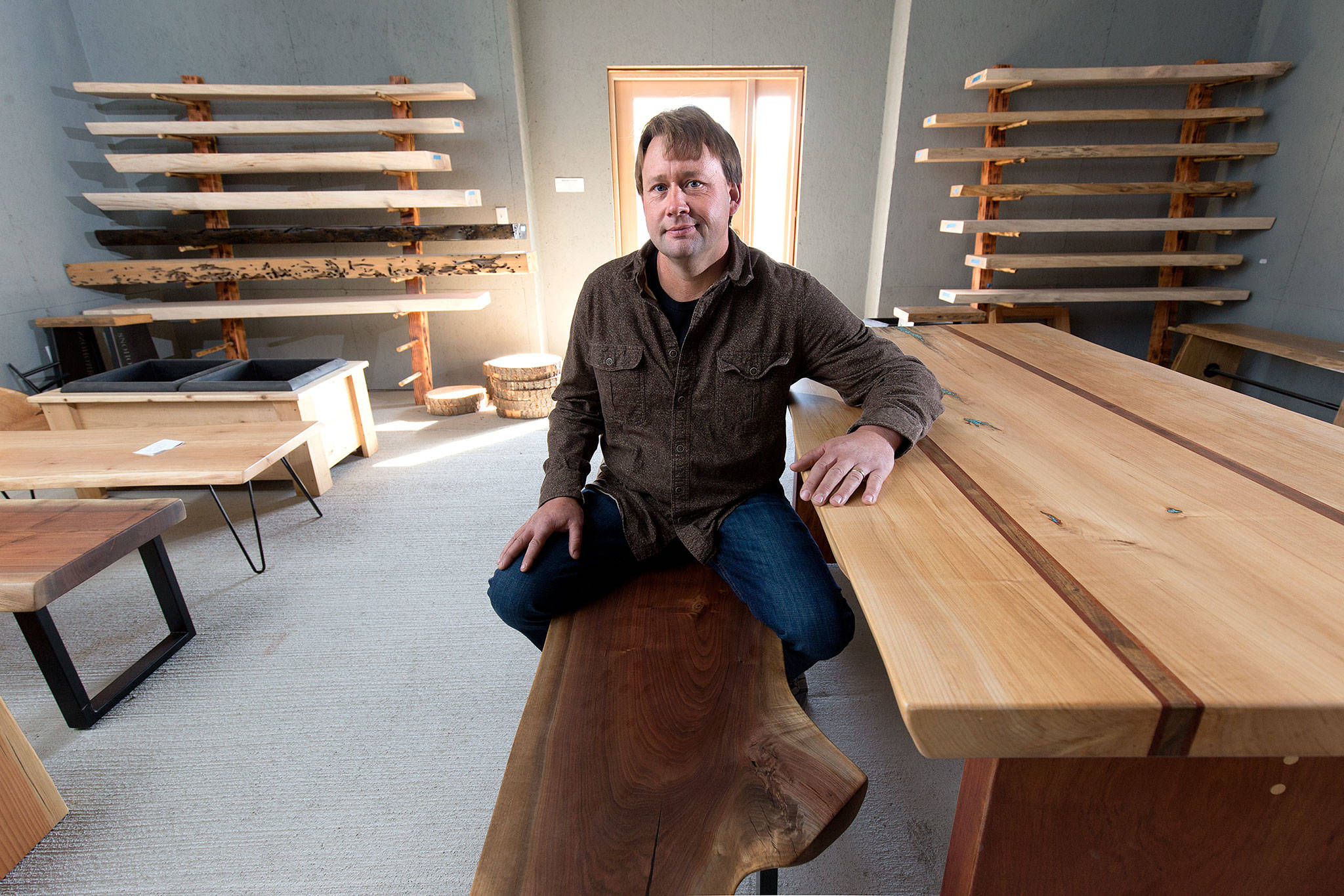 Kevin Stormo, owner of Stormo Hardwoods, in his showroom at 2730 Broadway in Everett. (Andy Bronson / The Herald)