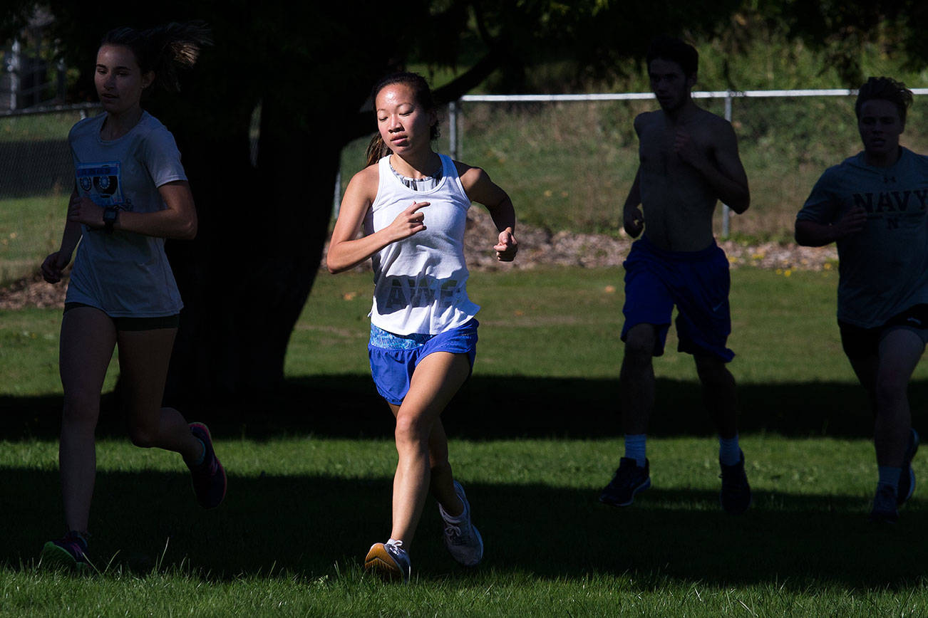 Snohomish cross country runner Megan Campbell runs with teammates during practice on Monday, Sept. 24, 2018 in Snohomish, Wa. (Andy Bronson / The Herald)