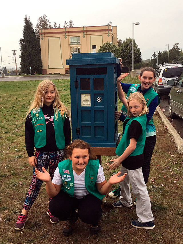 Arlington Girl Scouts Ivy Heart, Riliegh Carr, Patience Hartman and Abby Stevenson designed, built and installed a Little Free Library just west of the Presidents Elementary School as part of a Bronze Award project. (Contributed photo)