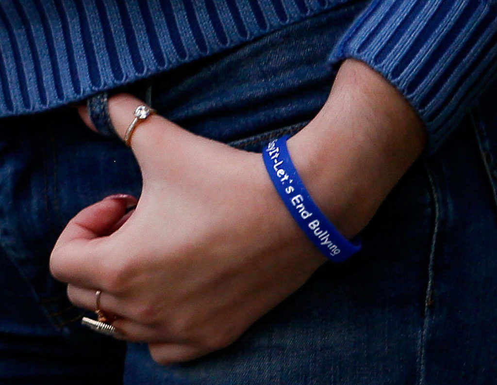 MacKenzie Haarlow wears a wrist band with the slogan she created to bring attention to—and help reduce—bullying. The full slogan reads: Weigh It Before You Say It. – Let’s End Bullying. (Dan Bates / The Herald)
