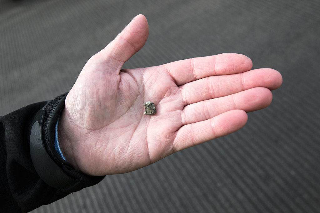 A small rock can be dangerous to airplane exteriors and engines. Repaving should fix the problem of loose material on the runway, officials said. (Andy Bronson / The Herald)
