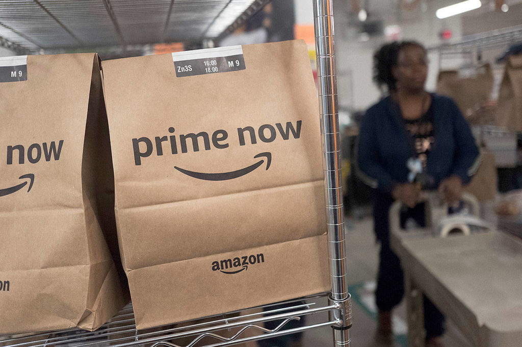 Prime Now customer orders, ready for delivery at the Amazon warehouse in New York. (AP Photo/Mark Lennihan, File) 
