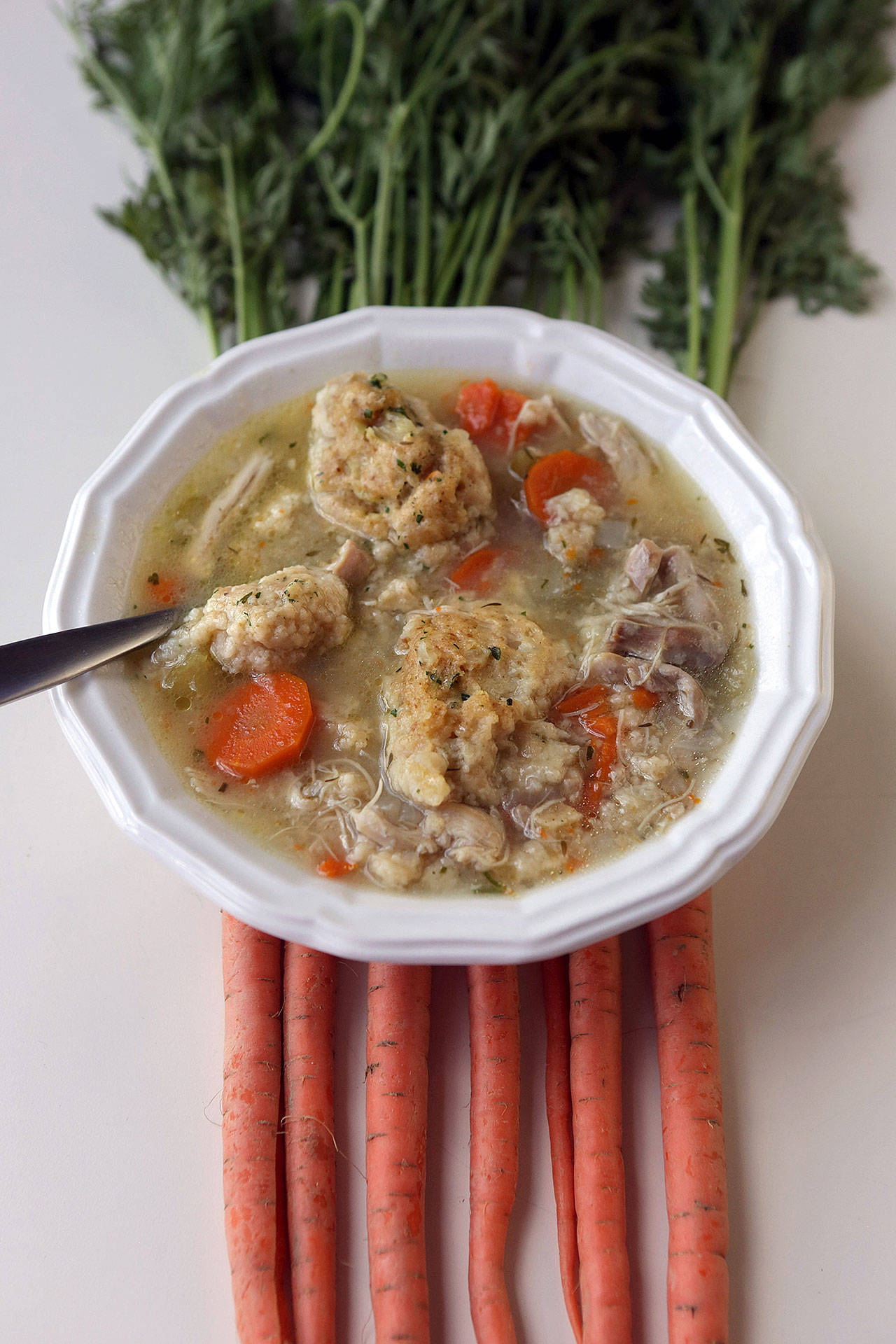 Chicken and dumplings. These dumplings are dropped by the spoonful into the simmering water, not rolled out into shapes first. (Hillary Levin/St. Louis Post-Dispatch)