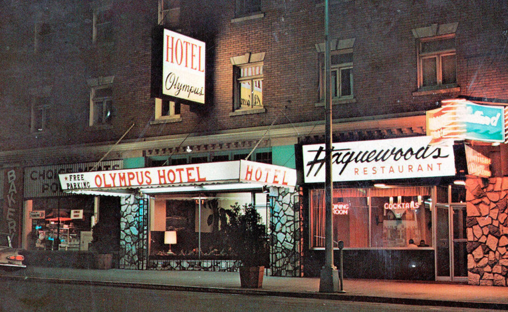 A postcard shows the Olympus Hotel and the neighboring Haguewood Restaurant in 1970.
